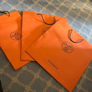 Hermes 3 shopping bags. Two are big and one is smaller, fits a shoe box.